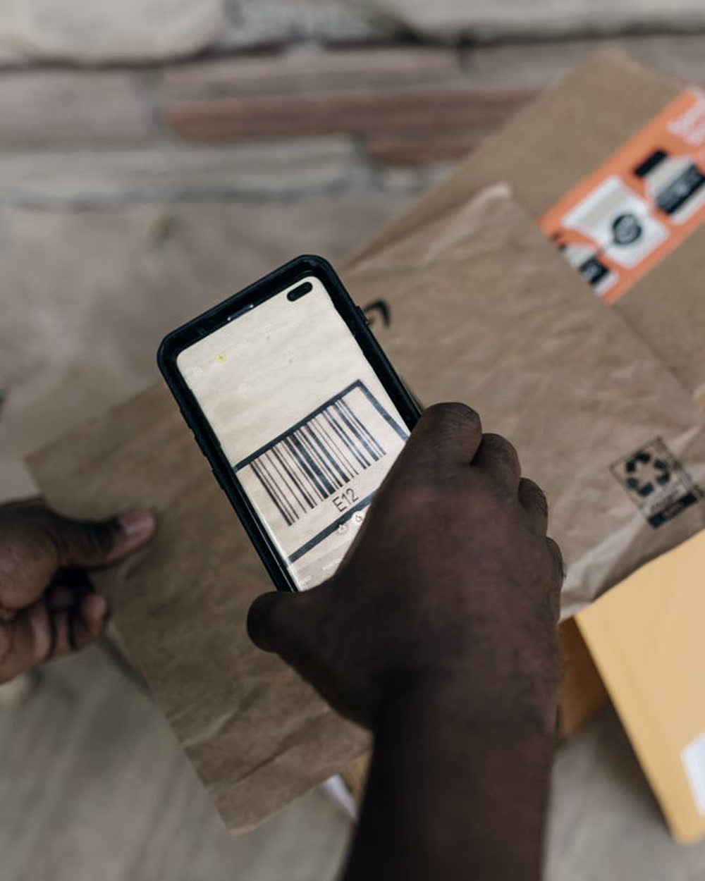 A Zedex courier scanning the barcode on a parcel
